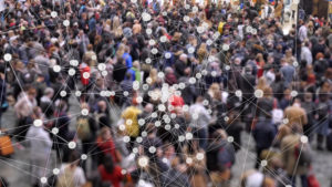 Image showing the spread of coronavirus among a crowd of people.